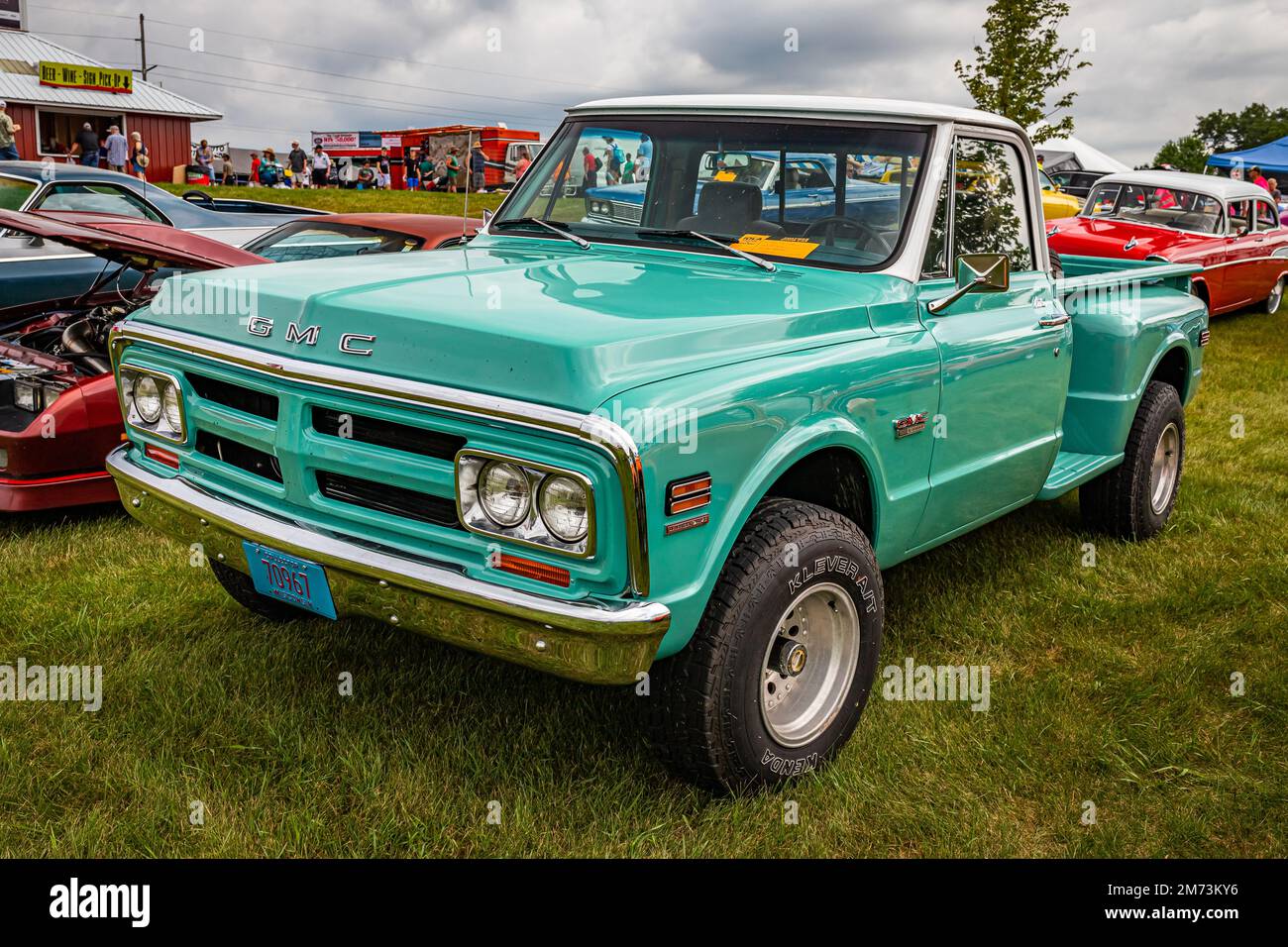 Iola, WI - July 07, 2022: High perspective front corner view of a 1968 GMC 1500 Stepside Pickup Truck at a local car show. Stock Photo