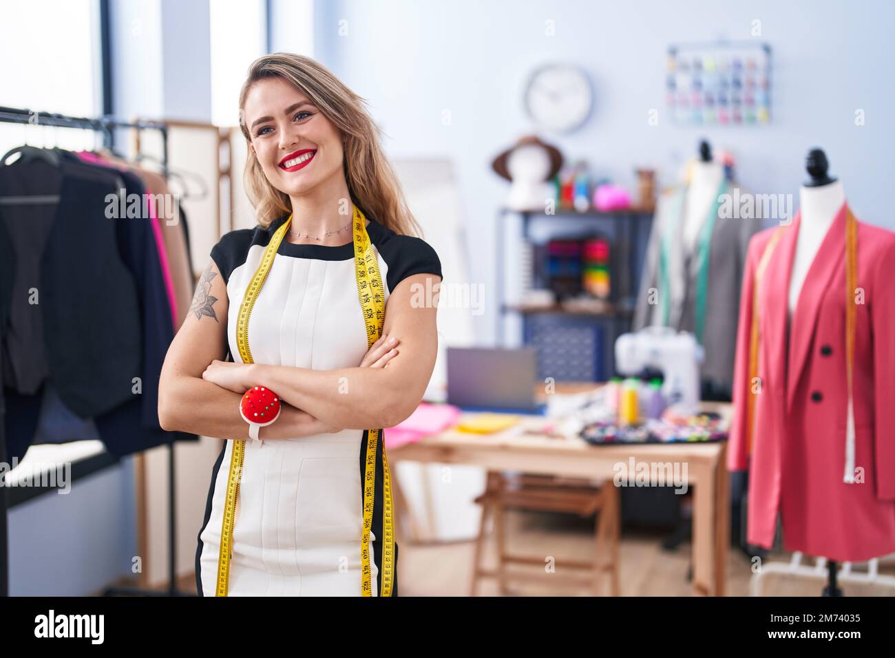 Young beautiful hispanic woman tailor smiling confident standing with ...