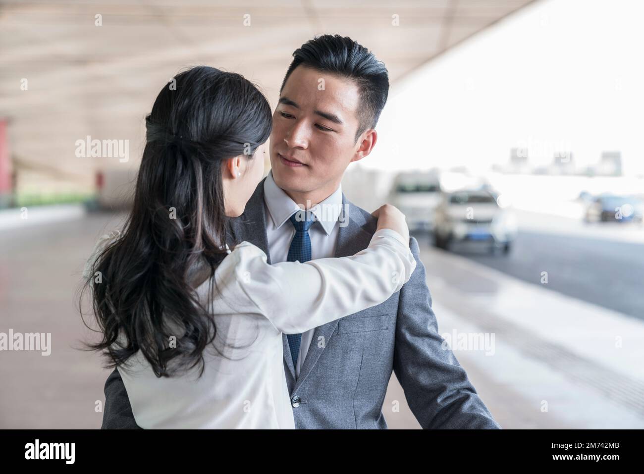 Two friends hug airport hi-res stock photography and images - Alamy