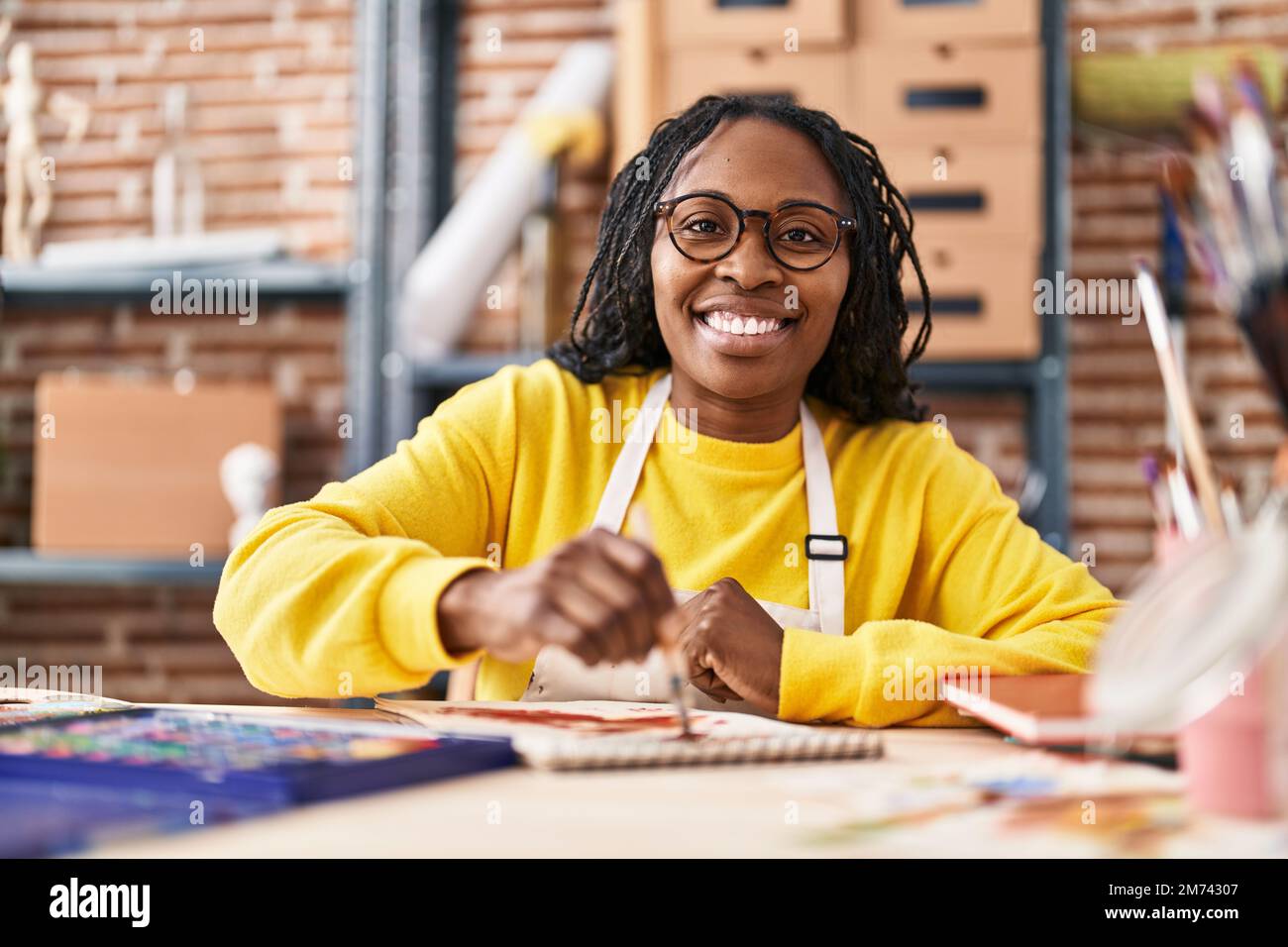 African american woman artist smiling confident standing with arms ...