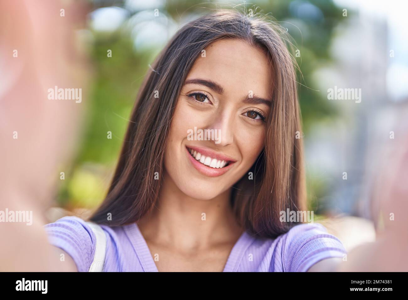 Young beautiful hispanic woman smiling confident making selfie by ...