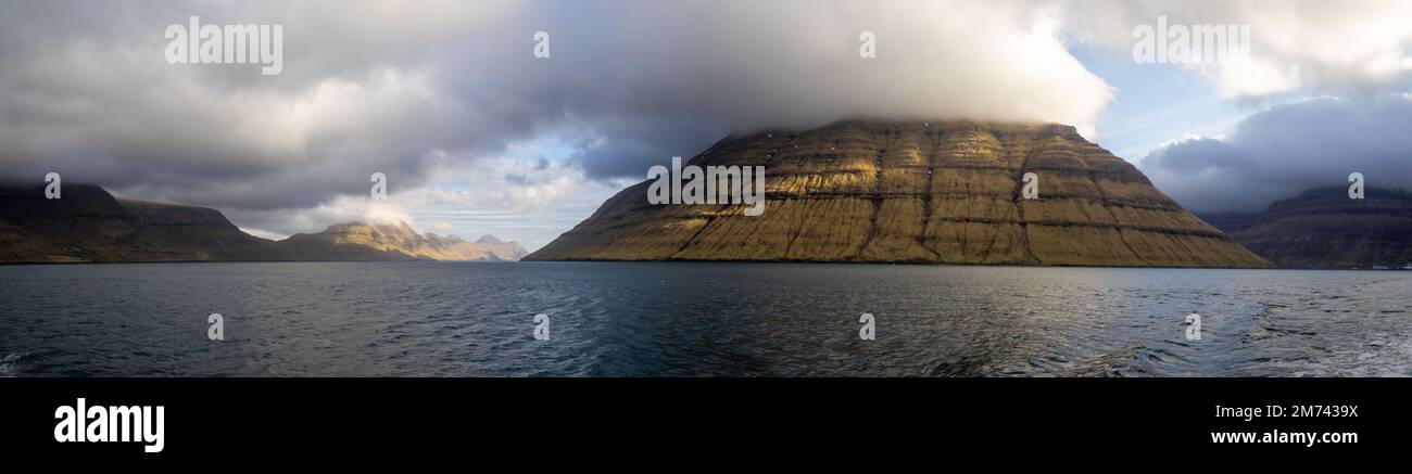 Panorama of Kunoy and Kalsoy islands with low clouds Stock Photo