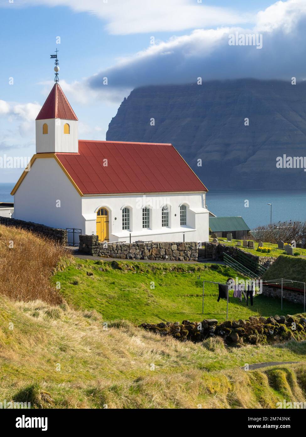 Mikladalur church with Kunoy island in background Stock Photo