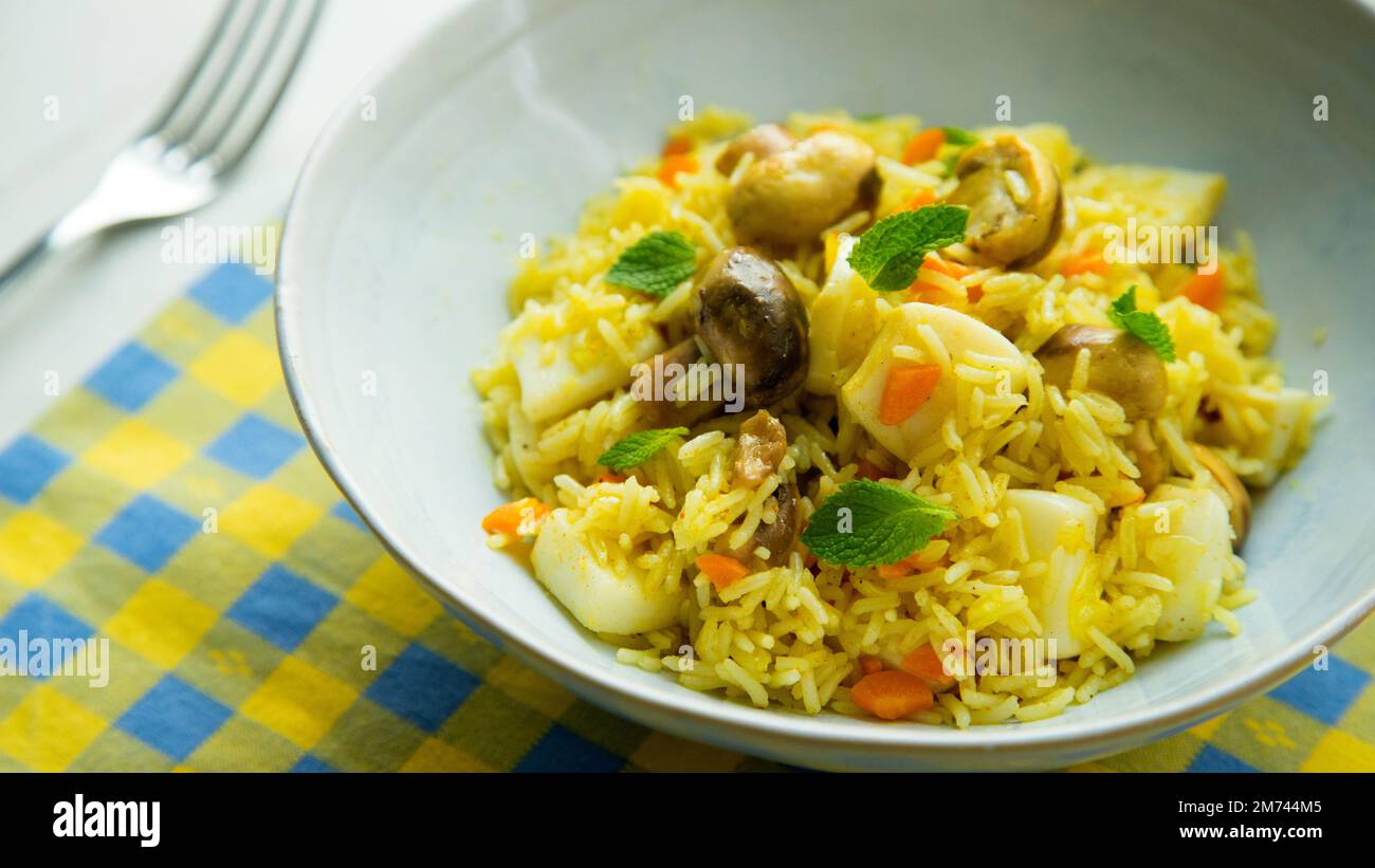 Cuttlefish Fried Rice Fried rice with curry, vegetables and cuttlefish Stock Photo - Alamy