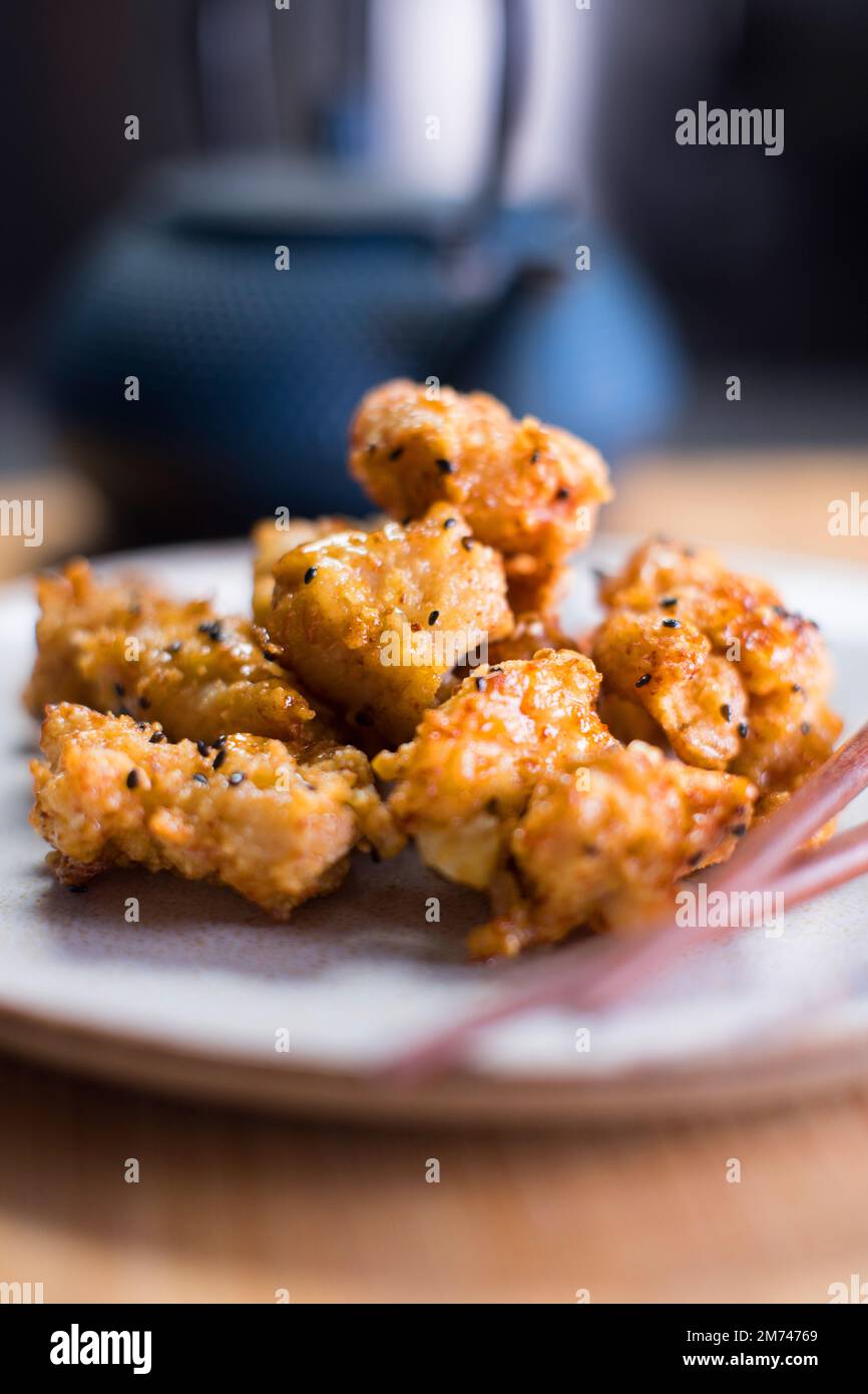 Karaage chicken served with honey and sesam Stock Photo Alamy