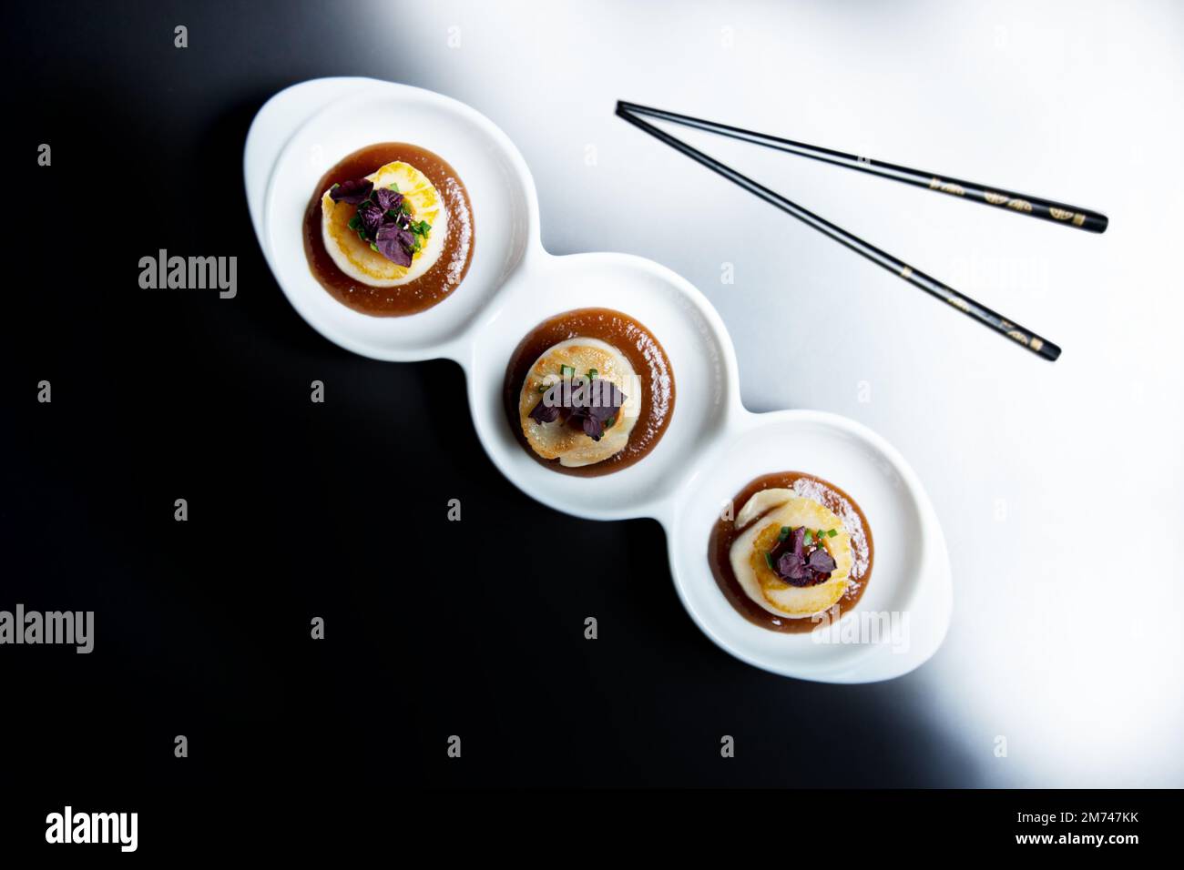 Grilled scallops with miso sauce in a luxury restaurant in Tokyo Stock