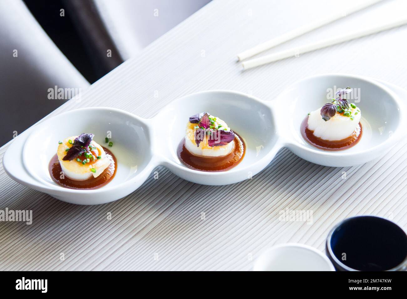 Grilled scallops with miso sauce in a luxury restaurant in Tokyo Stock