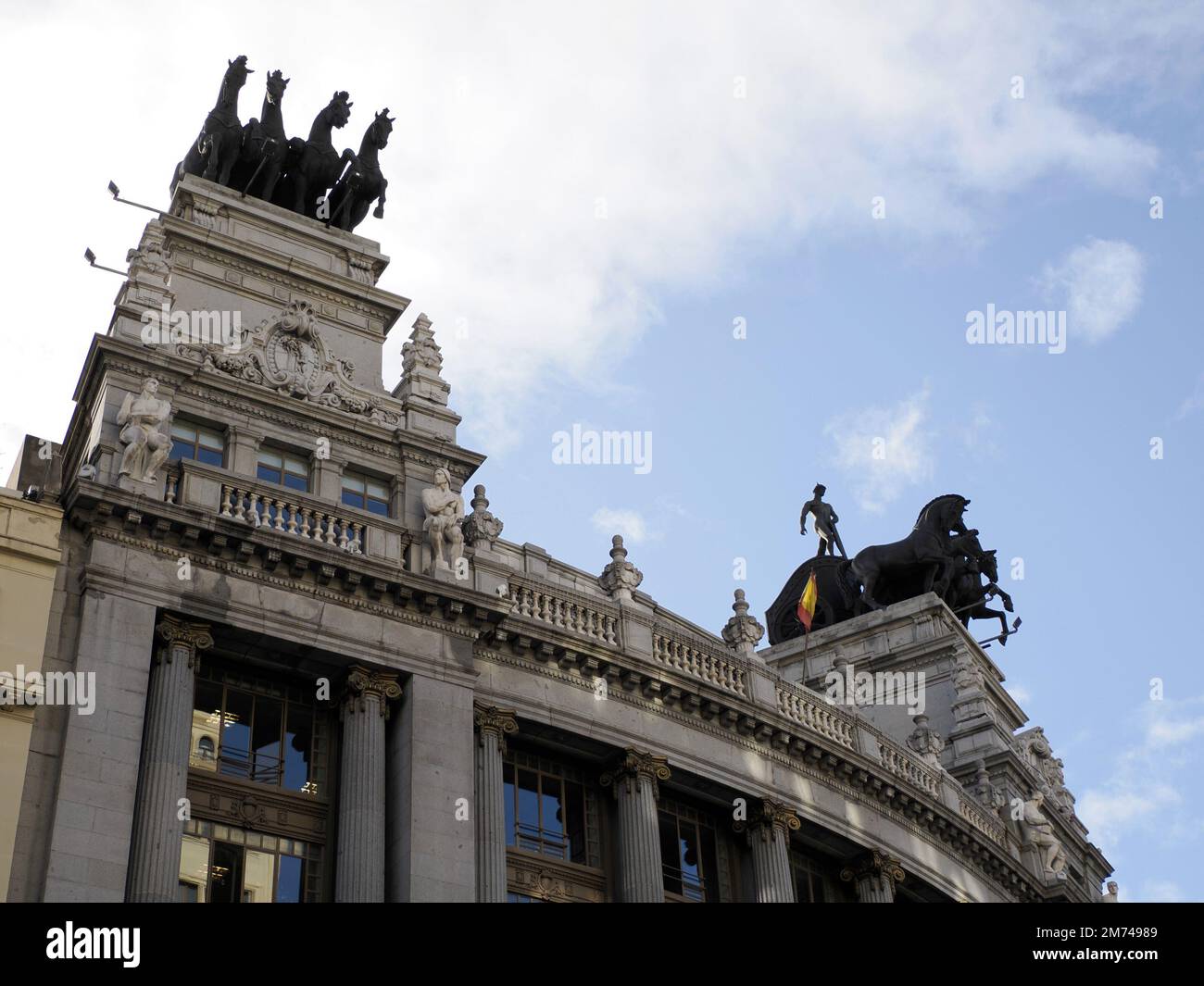 Metropolis Building, an example of Romanesque, Beaux-Arts and Romanesque Revival architecture, at Calle de Alcala and Gran Via in Madrid, Spain, Stock Photo