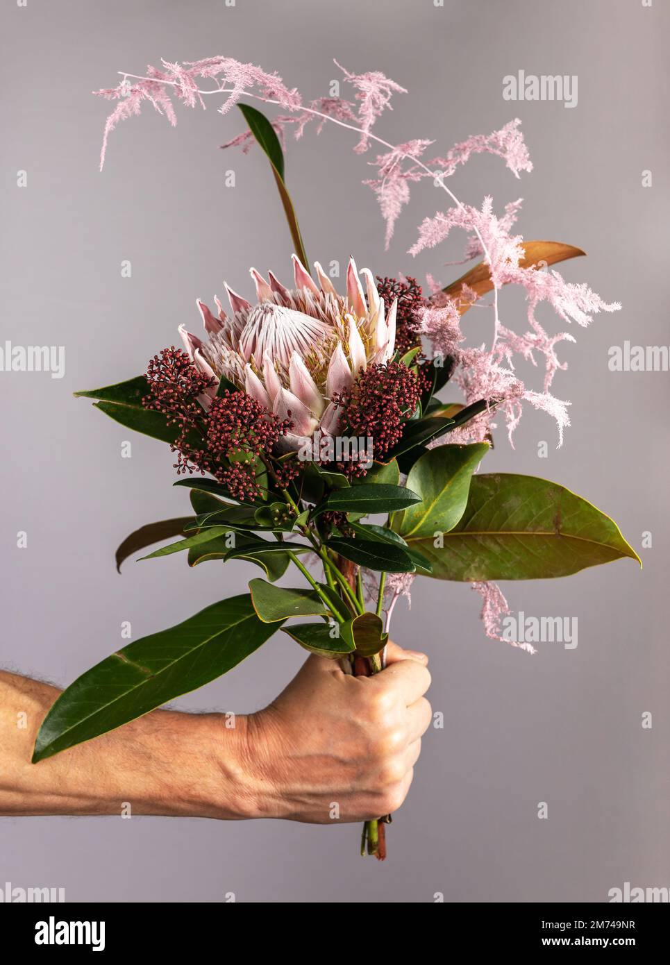 Flower bunch in men hand, spring romantic gift. Gentle modern