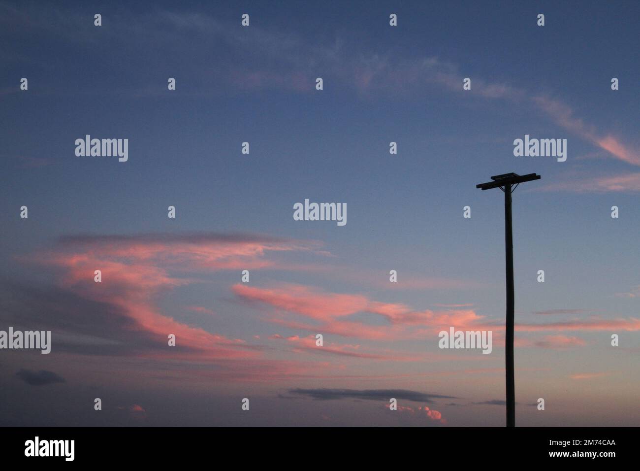 A breathtaking sunset with pink clouds Stock Photo - Alamy