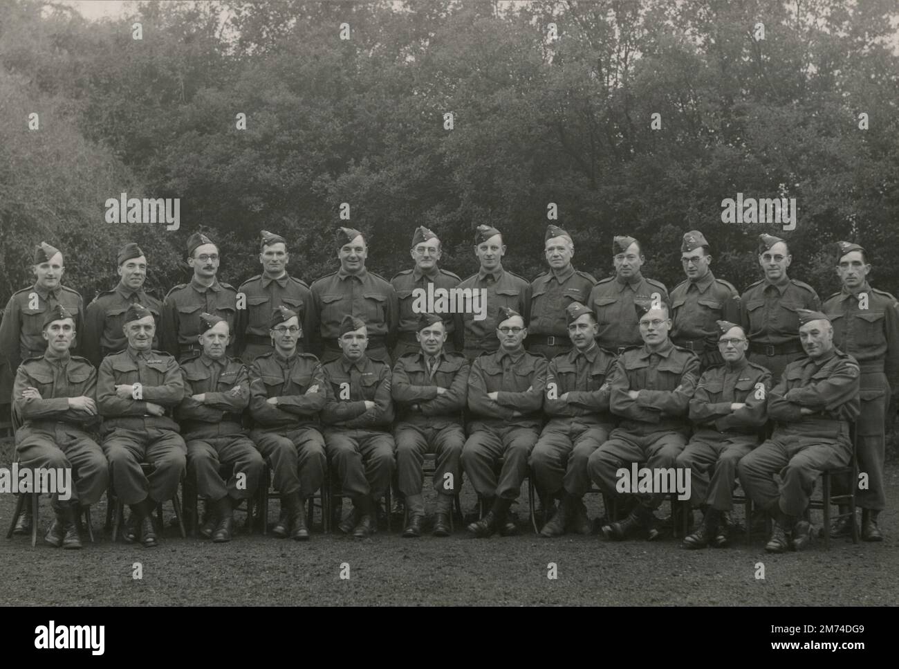 A photograph of members of the 53rd (Kent) Battalion Home Guard, dating from 1944. Raised and based in Orpington, Kent, this battalion, which was affiliated the Queen’s Own Royal West Kent Regiment, was an armed citizen militia originally formed in May 1940 as a unit of Local Defence Volunteers for the purpose of defending Britain again a Nazi invasion. Following the allied D-Day landings in France and subsequent advance towards Germany, the Home Guard was stood down in December 1944 as the threat of an invasion of the British Isles had diminished. They were finally disbanded in December 1945. Stock Photo