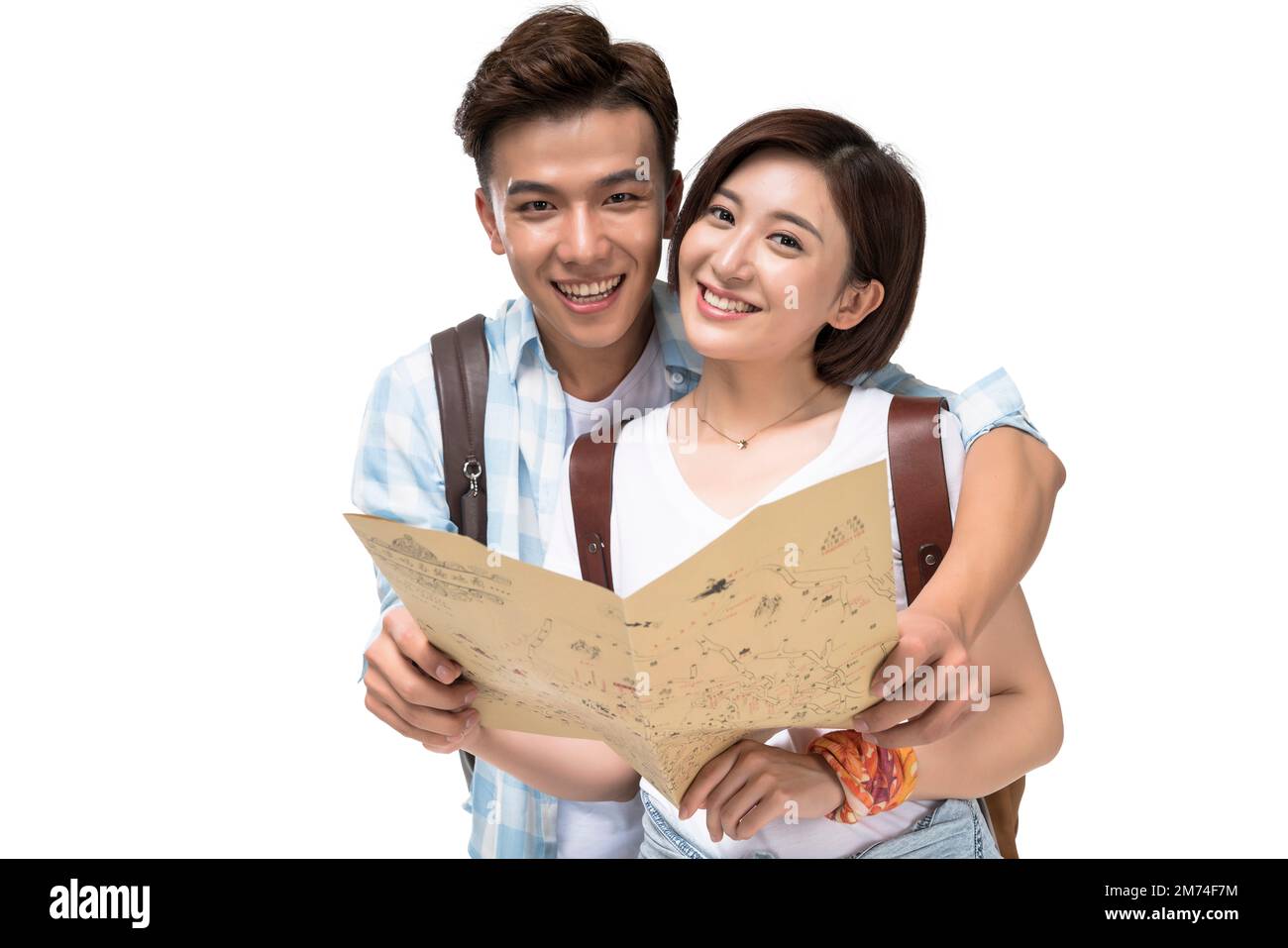 Two happy young women camera map hi-res stock photography and images ...