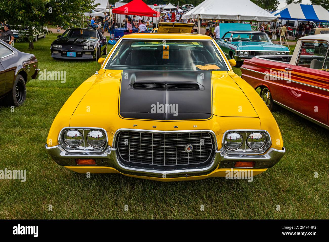 Iola, WI - July 07, 2022: High perspective front view of a 1972 Ford Gran Torino Sport Coupe at a local car show. Stock Photo