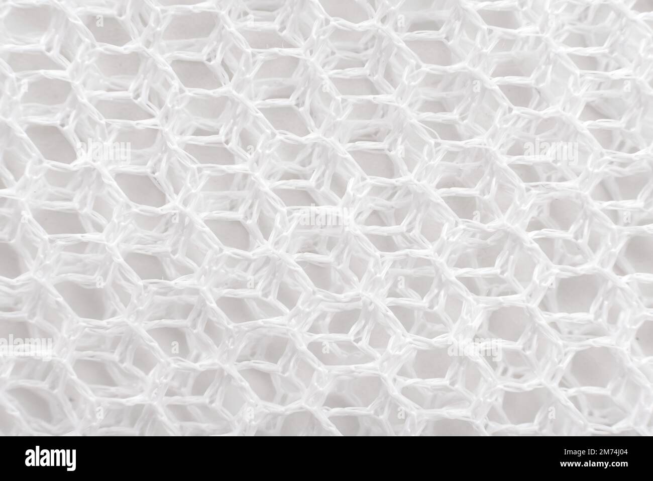 Texture or background of mesh fabric in white. Mesh material Stock