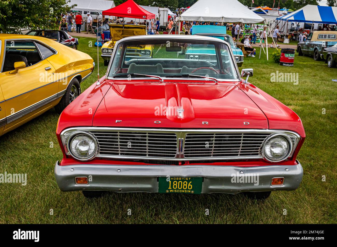 Iola, WI - July 07, 2022: High perspective front view of a 1965 Ford Falcon Ranchero Pickup at a local car show. Stock Photo