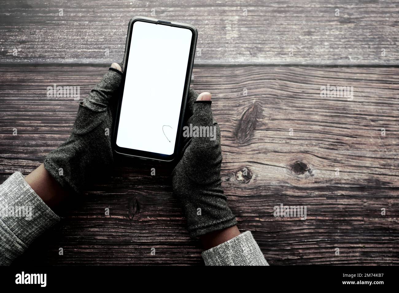 hacker hand stealing data from smart phone  Stock Photo