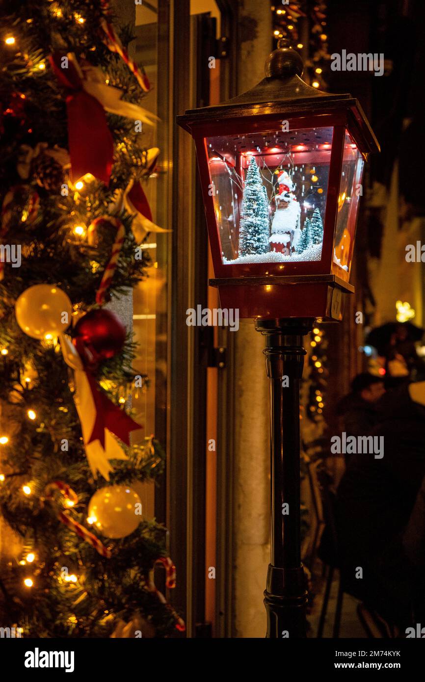 Lantern with Santa Claus in the snow Stock Photo
