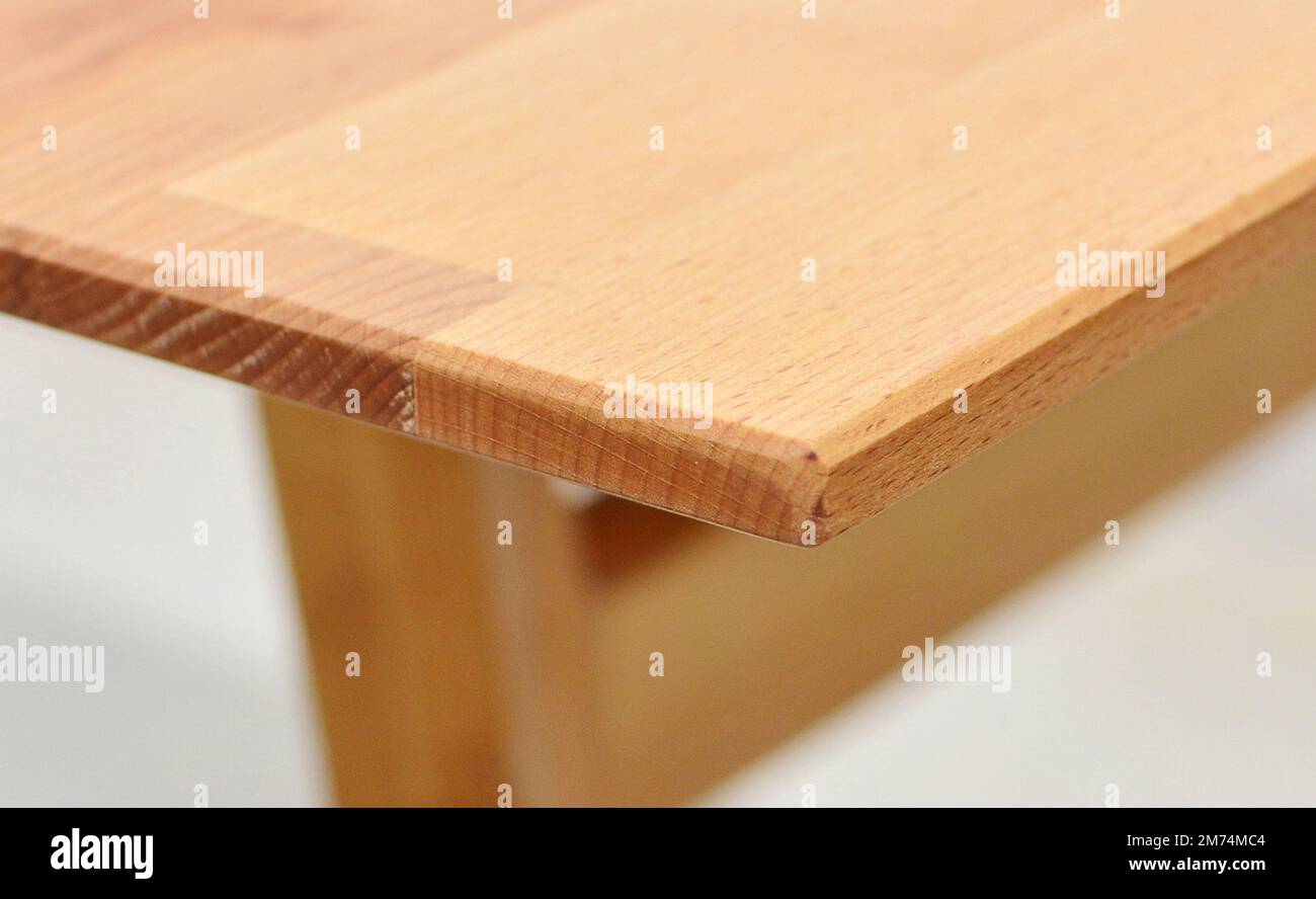 Wooden table top surface isolated over white background. Solid wood
