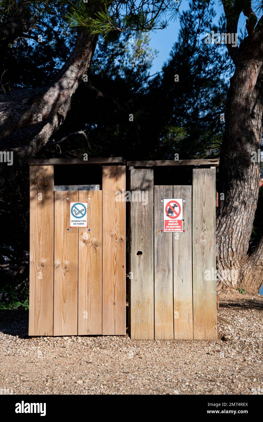 Wooden garbage, Trash for garbage, made of wood with information sign in French Stock Photo