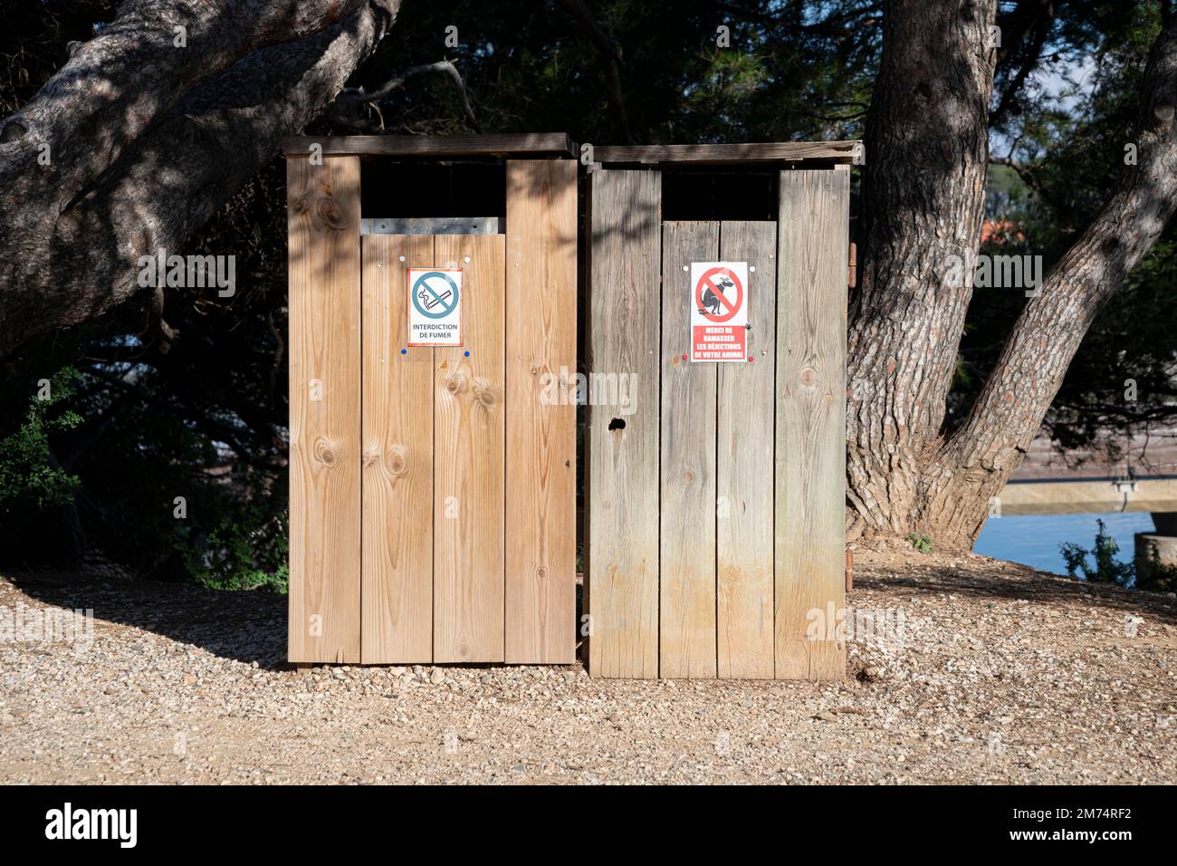 Wooden garbage, Trash for garbage, made of wood with information sign in French Stock Photo