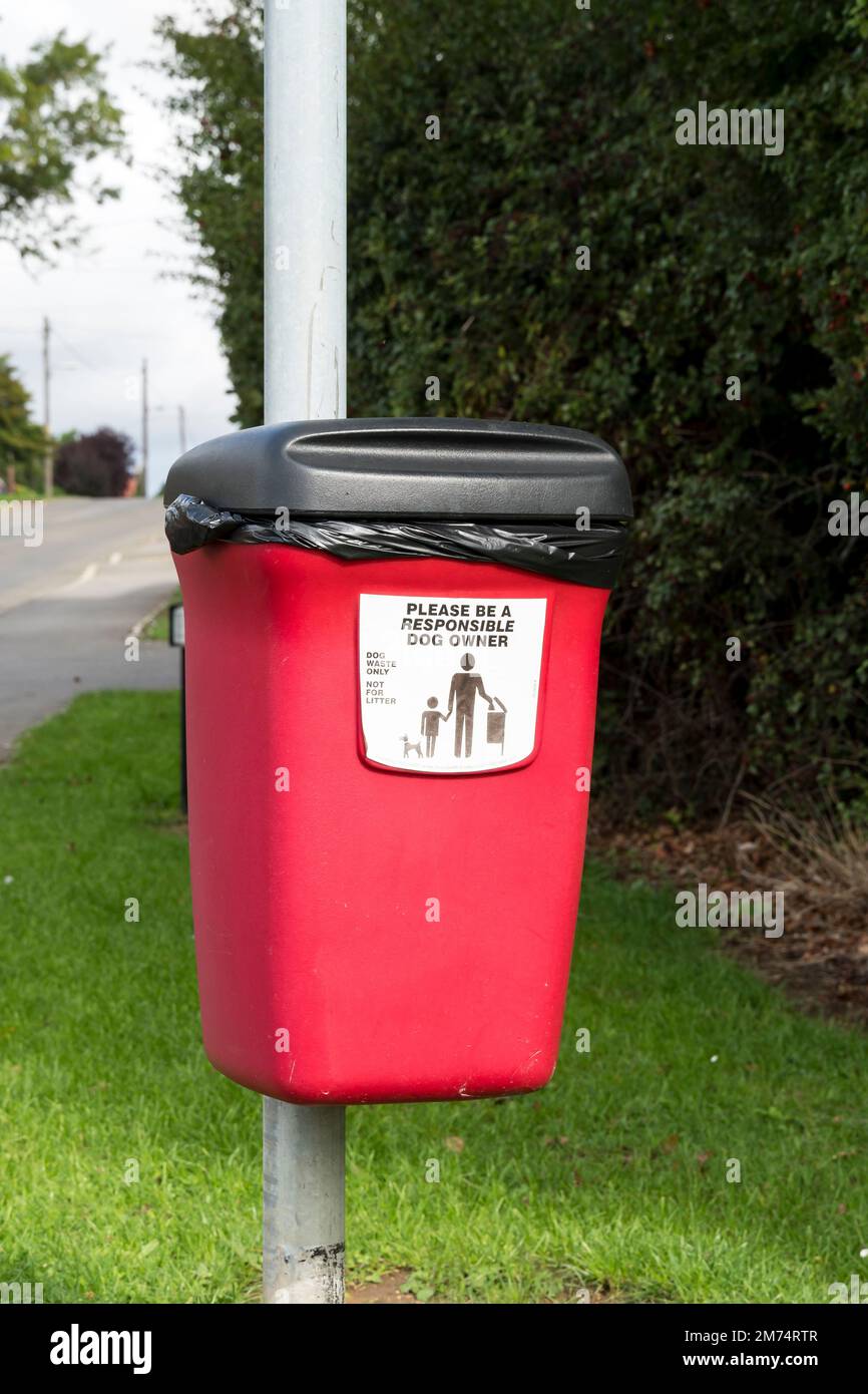 Red Dog Poo bin attached to post, Church Lane Cherry Willingham Lincoln