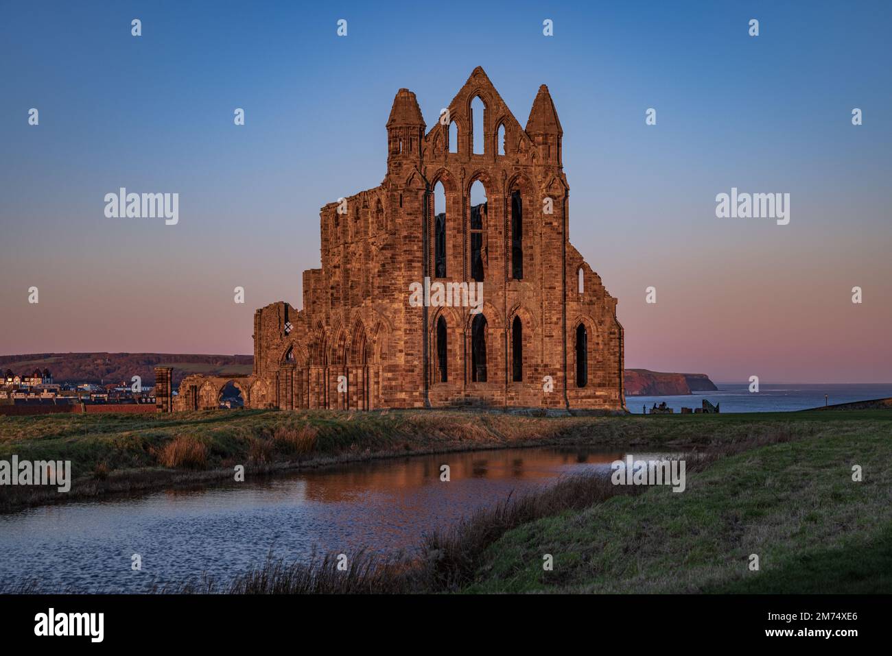 Whitby Sun Whitby Abbey illuminated by the early morning sun Stock Photo - Alamy