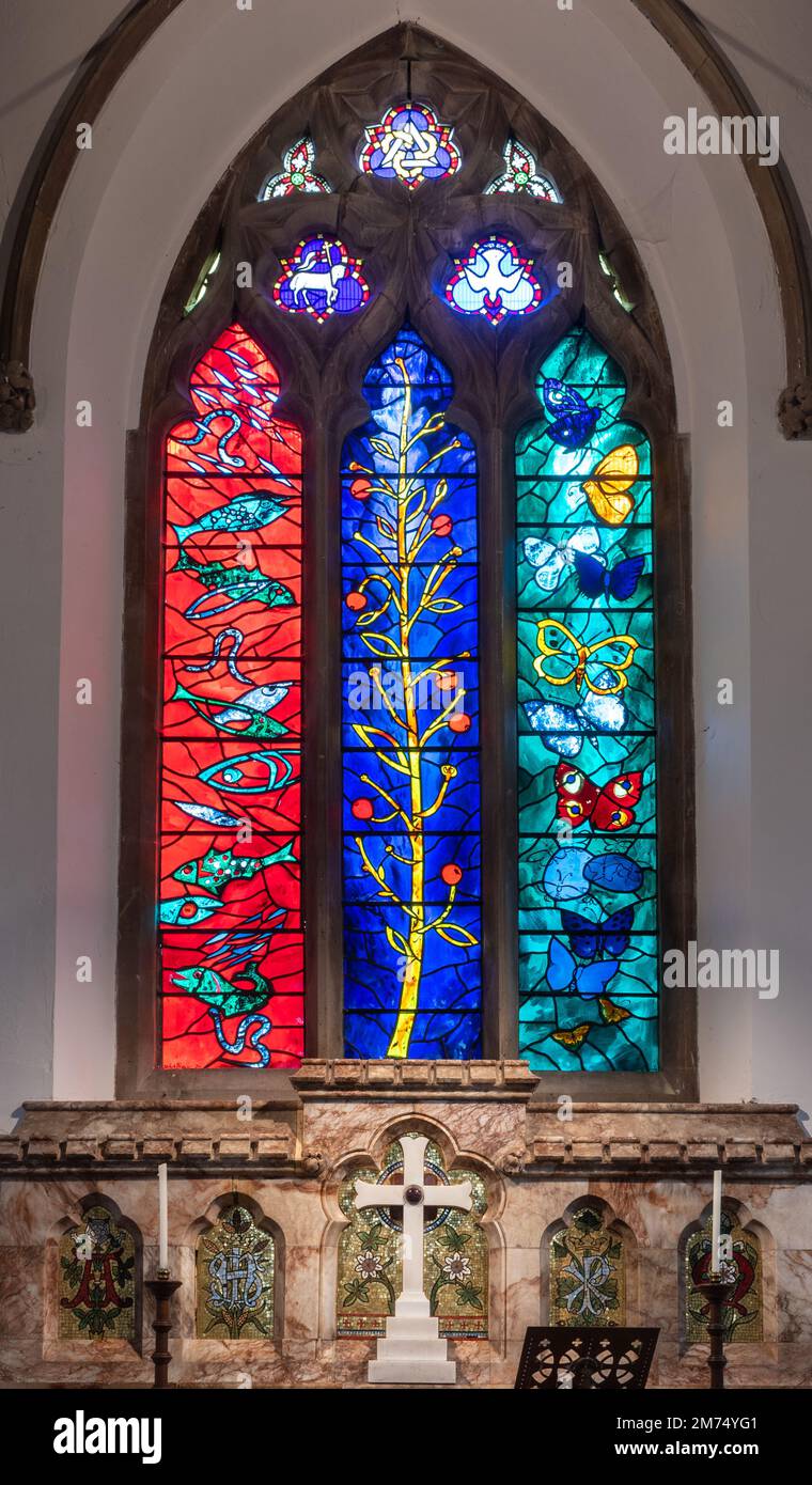Stained glass window designed by John Piper in St Bartholomew's Church in Nettlebed village, Oxfordshire, England, UK. The East window. Stock Photo