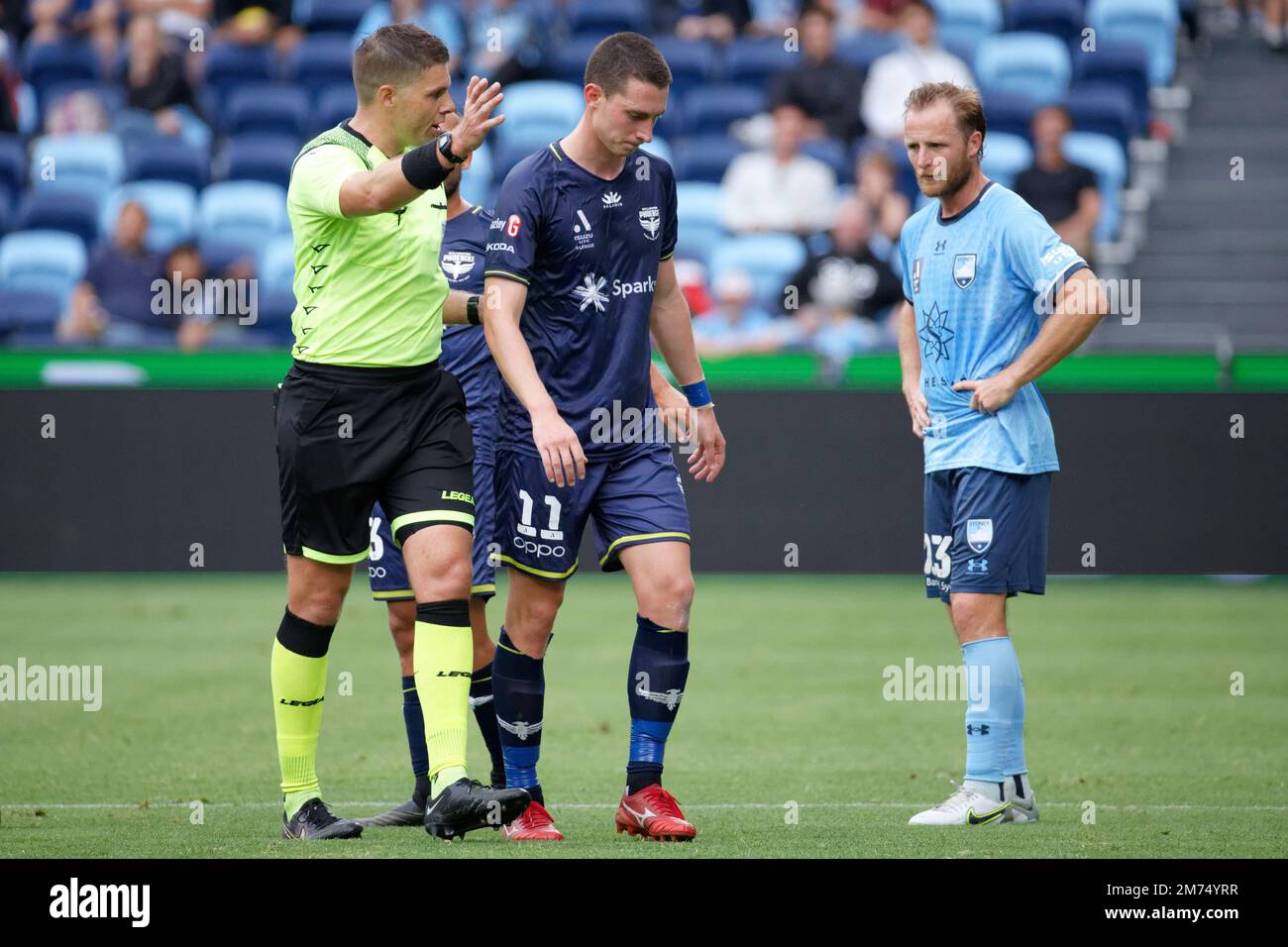Referee Shaun Evans asks Bozhidar Kraev of Wellington Phoenix to leave
