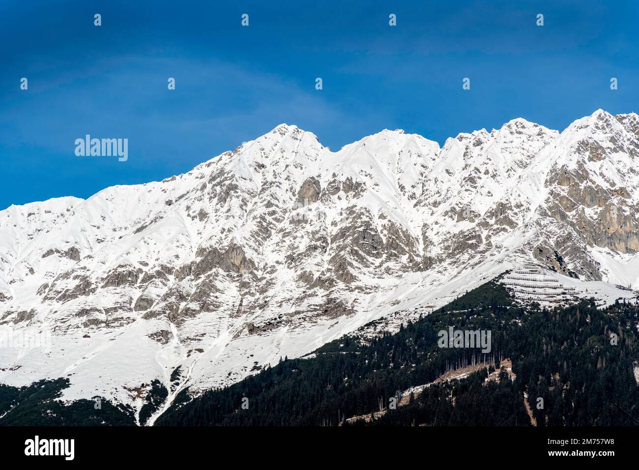 Landscape of snow capped mountains and ski resort in the Austrian Alps, winter Europe Stock Photo