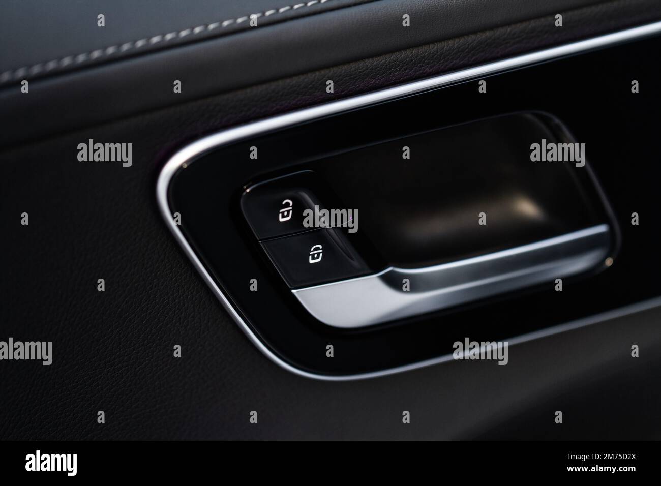 Car door lock unlock button close up. Modern car door lock. Door