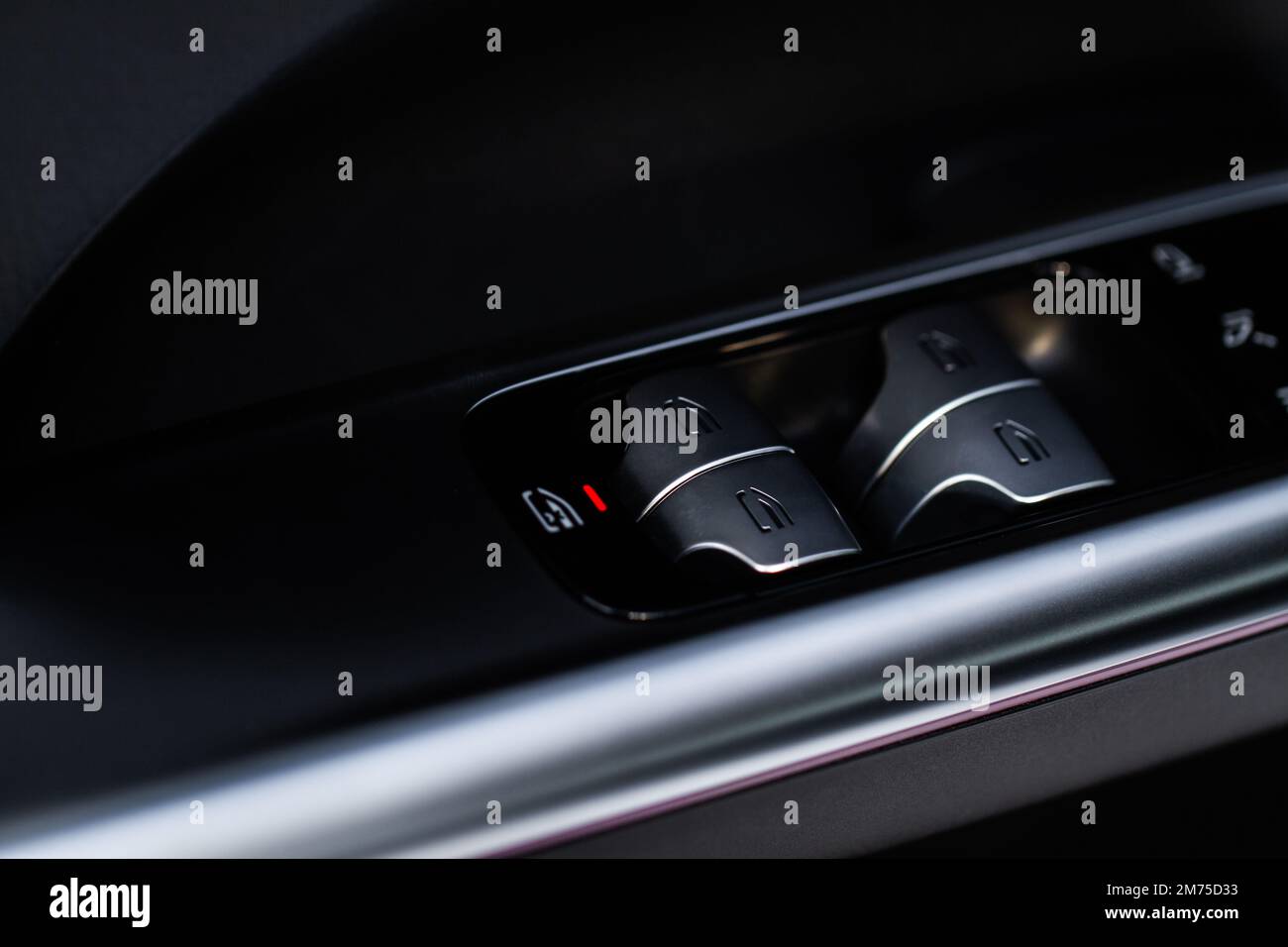 Close up view of button controlling window in modern car interior
