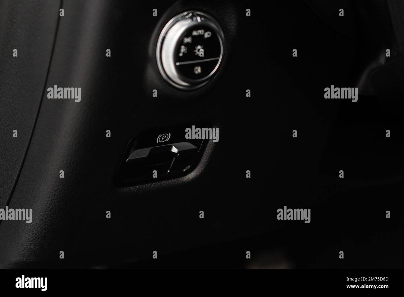 Parking brake of a modern car. Electronic handbrake. Modrn car hand brake, parking button. EPB