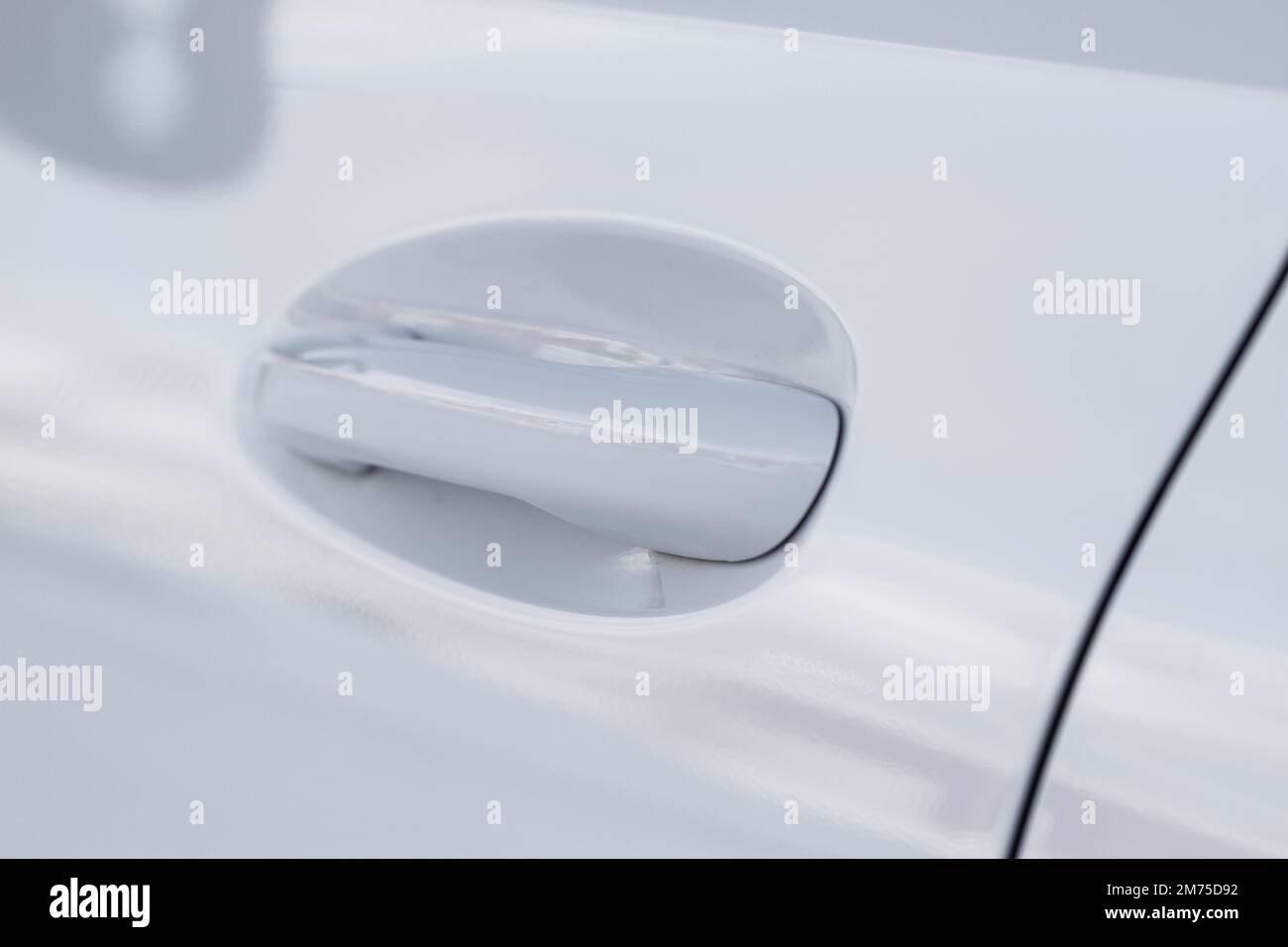 White car door handle. Keyless entry car door handle with touch sensor. Access button Stock