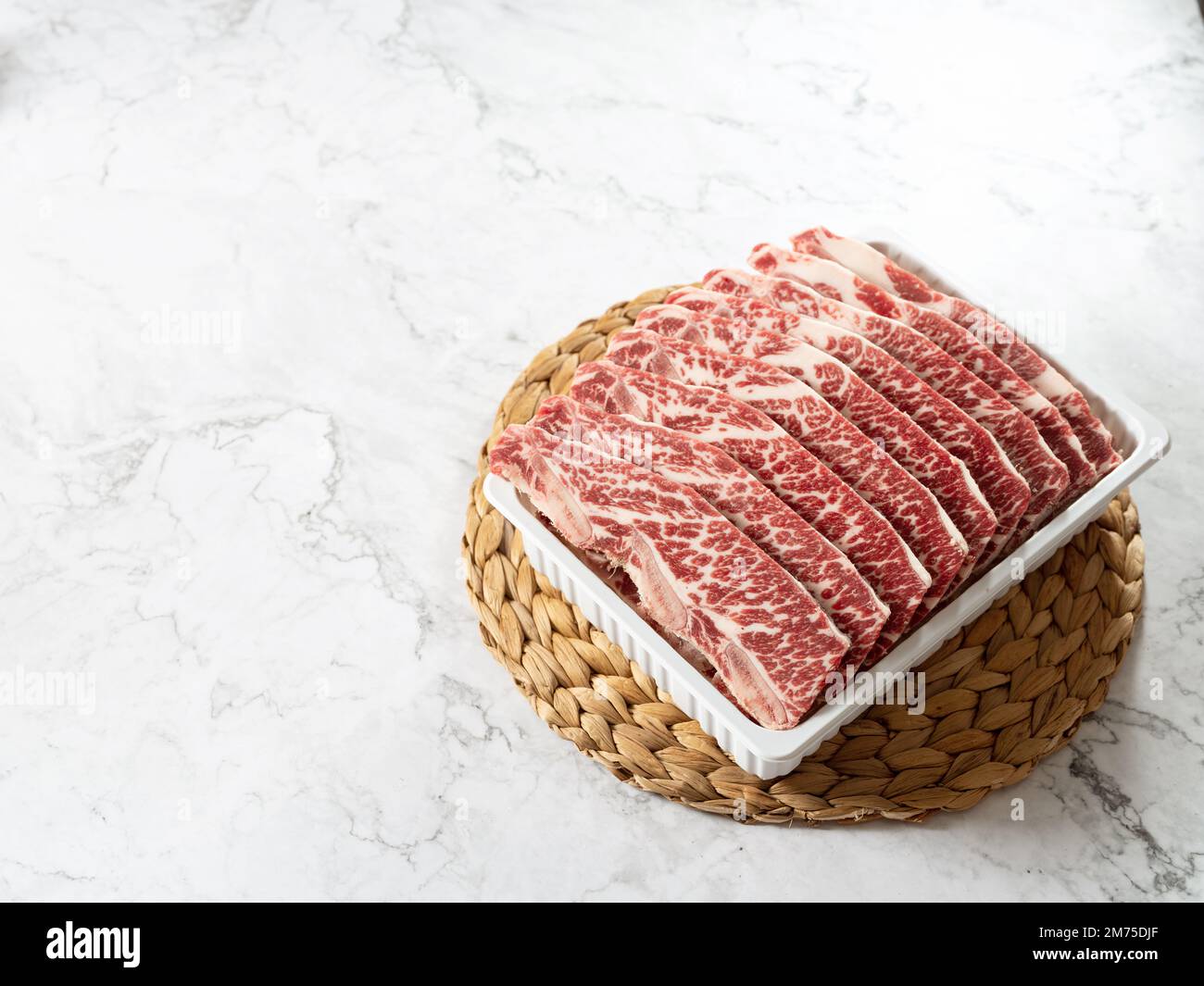 Raw ribs in packaging containers Stock Photo - Alamy