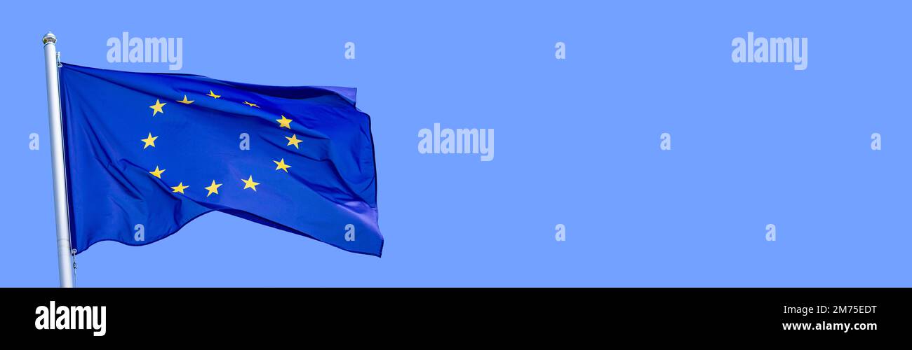 Flag of the European Union waving in the wind on flagpole against the ...
