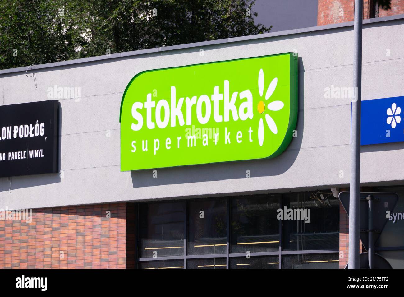 KOLOBRZEG, POLAND - AUGUST 6, 2022: Stokrotka Supermarket banner on a Polish grocery store Stock Photo