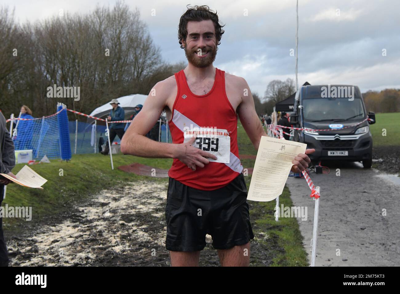 Bolton, UK. Saturday, 7 January, 2023. Cloudy, sunny intervals. Joe Steward, Salford Harriers and athletics club wins Greater Manchester Athletic Association 2022 (rescheduled) Annual Cross Country Championships, senior men's race. Leverhulme park, Bolton, Greater Manchester. © Yoko Shelley Credit: Yoko Shelley/Alamy Live News. Stock Photo