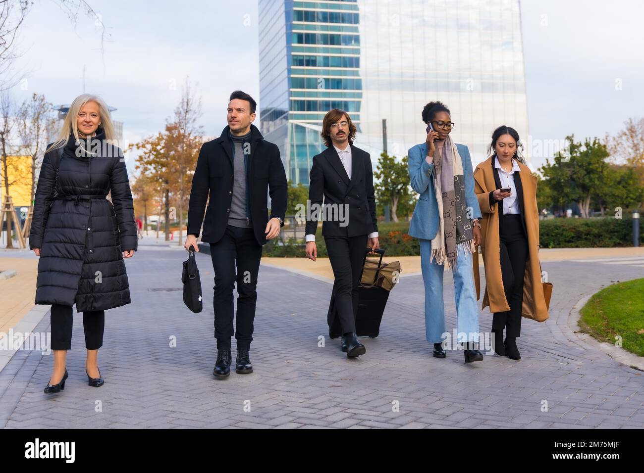 Multi-ethnic business people, business park, coworkers, walking to work Stock Photo
