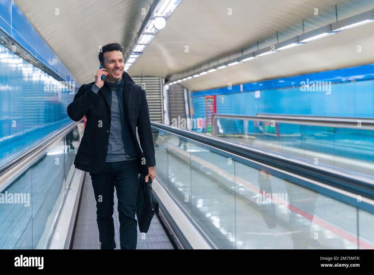 Portrait of middleaged Caucasian businessman walking down the subway commuting to work Stock