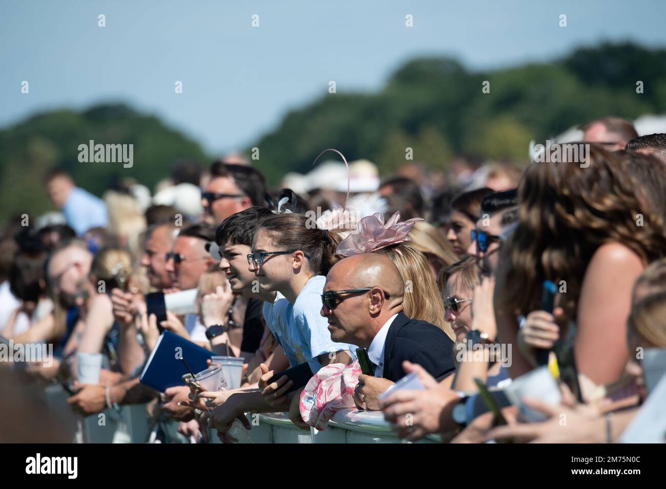 Outside Ascot Races Ascot, Berkshire, UK. 9th July, 2022. Racegoers enjoying the sunshine ...