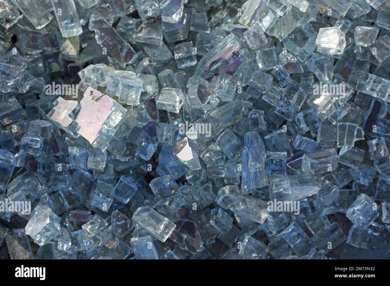 Broken glass pane and a pile of small glass shards and glass splinters Stock Photo Alamy