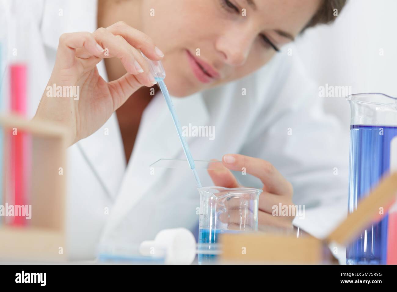 female student using pipettes and tubes Stock Photo Alamy
