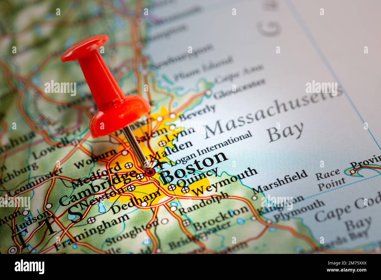 A push pin on a map of North America marking the location of the city of Boston Stock Photo