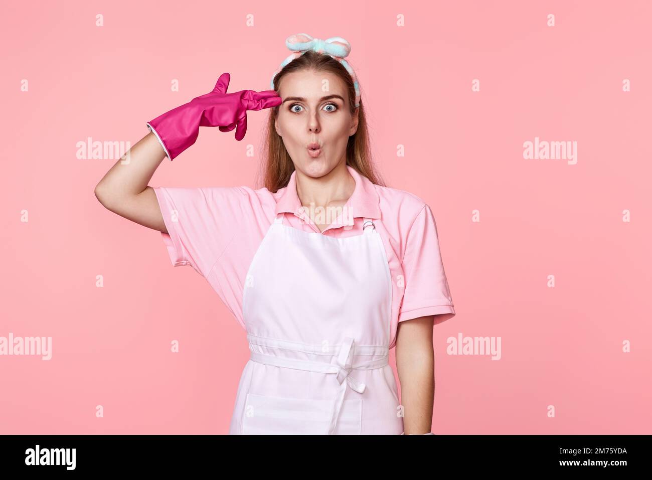 woman in rubber gloves and cleaner apron showing ok Stock Photo - Alamy
