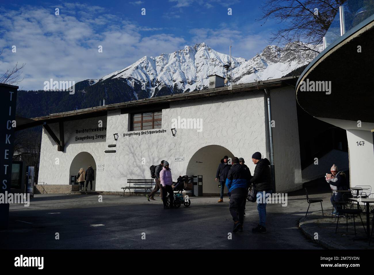 Innsbruck, Austria - December 2022: The Hungerburgbahn Nordkette Cable car station. The Hafelekarspitze mountain peak in the background towers over th Stock Photo