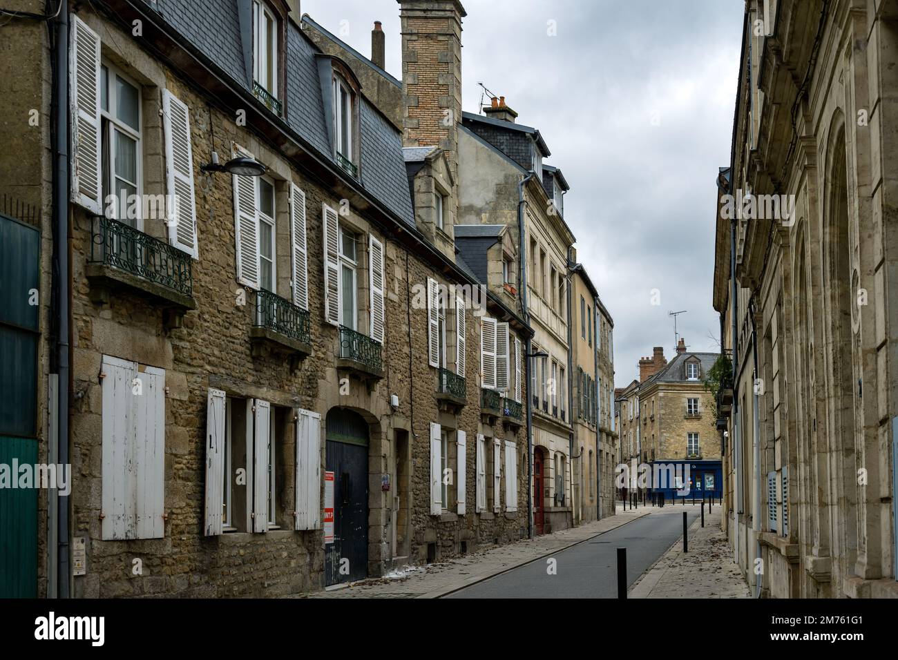 ALENCON, FRANCE - DECEMBER 28th, 2023: Houses in a street on a cloudy winter day, Nomandy Stock Photo