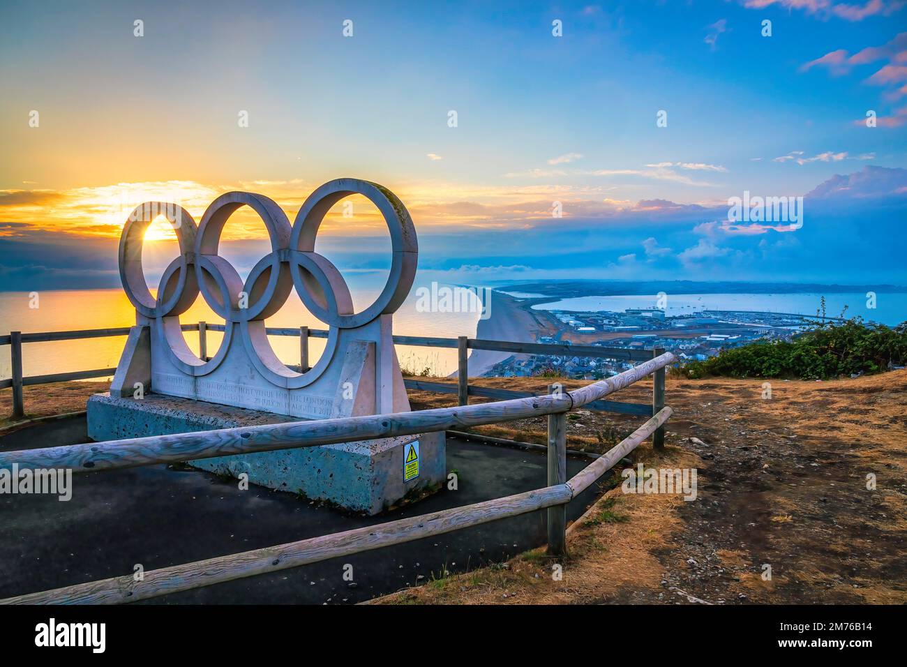 Olympic Rings stone sculpture on Isle of Portland overlooking Weymouth, Chesil Beach Stock Photo