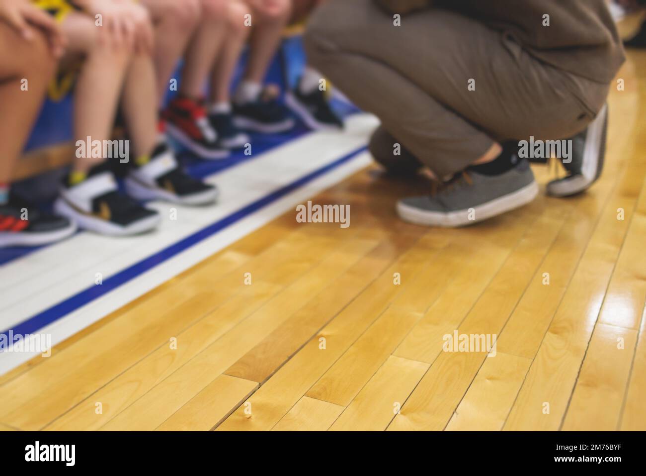 Junior young basketball team with a coach, group of kids children team