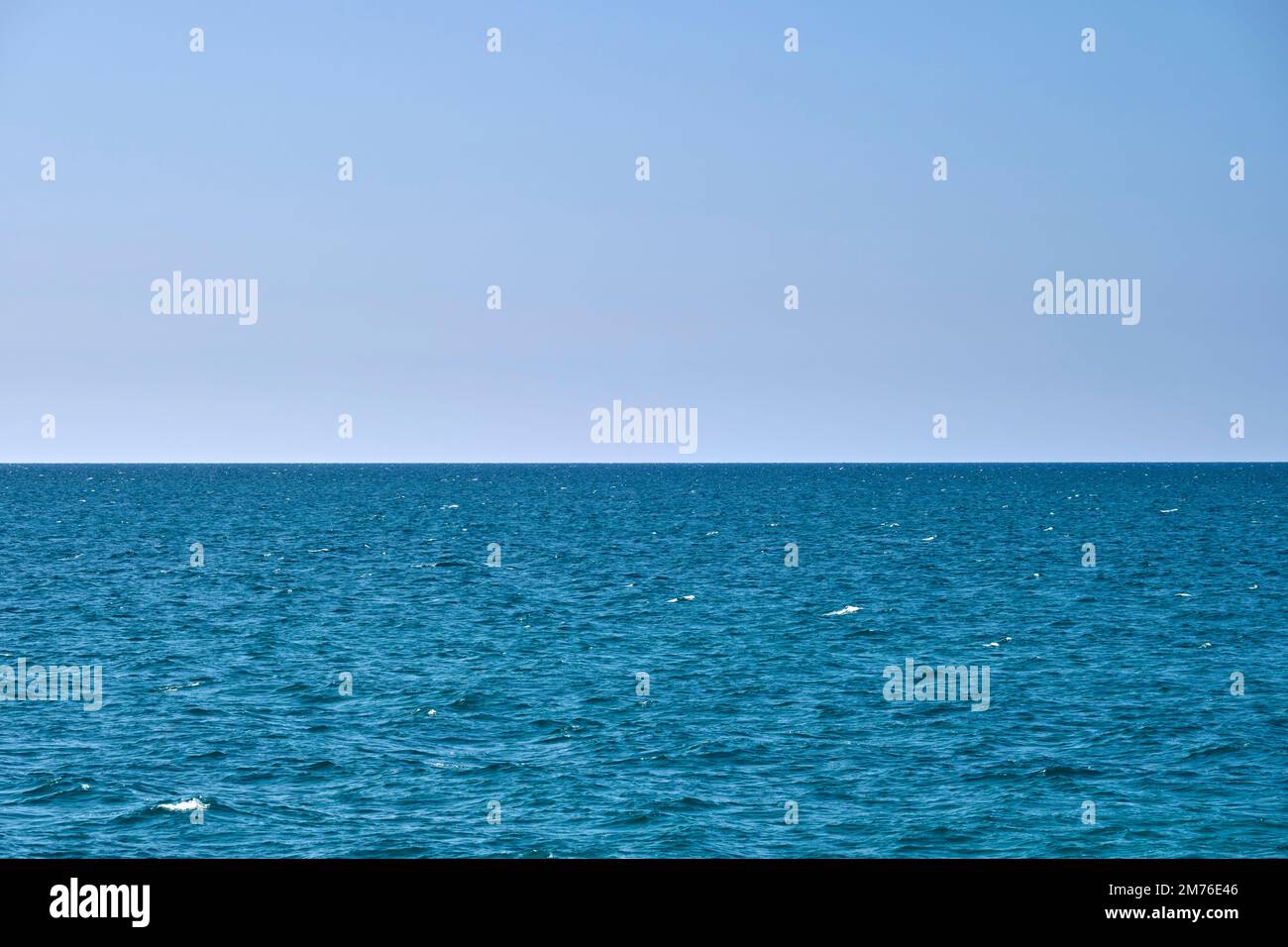 Small Ripples Ocean Closeup seascape surface of blue sea water with small ripple waves ...