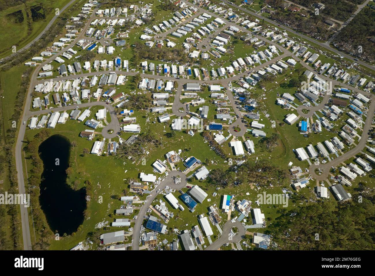 Badly damaged mobile homes after hurricane Ian in Florida residential